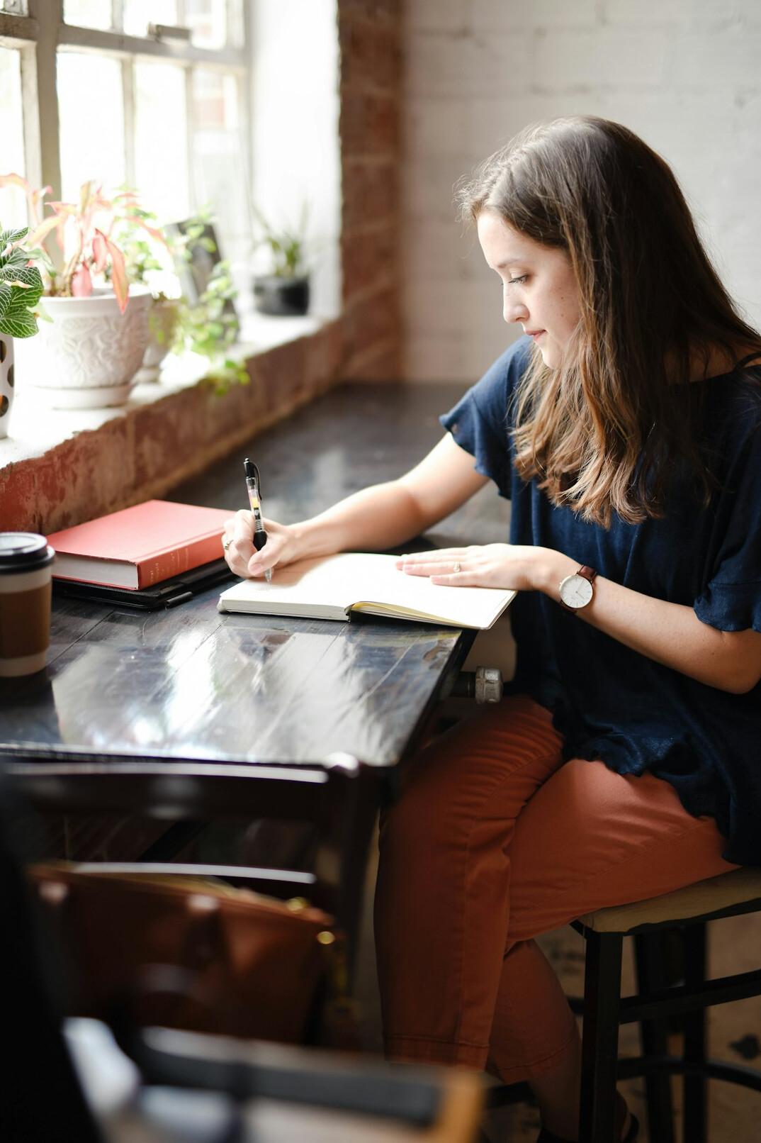 woman writing in journal