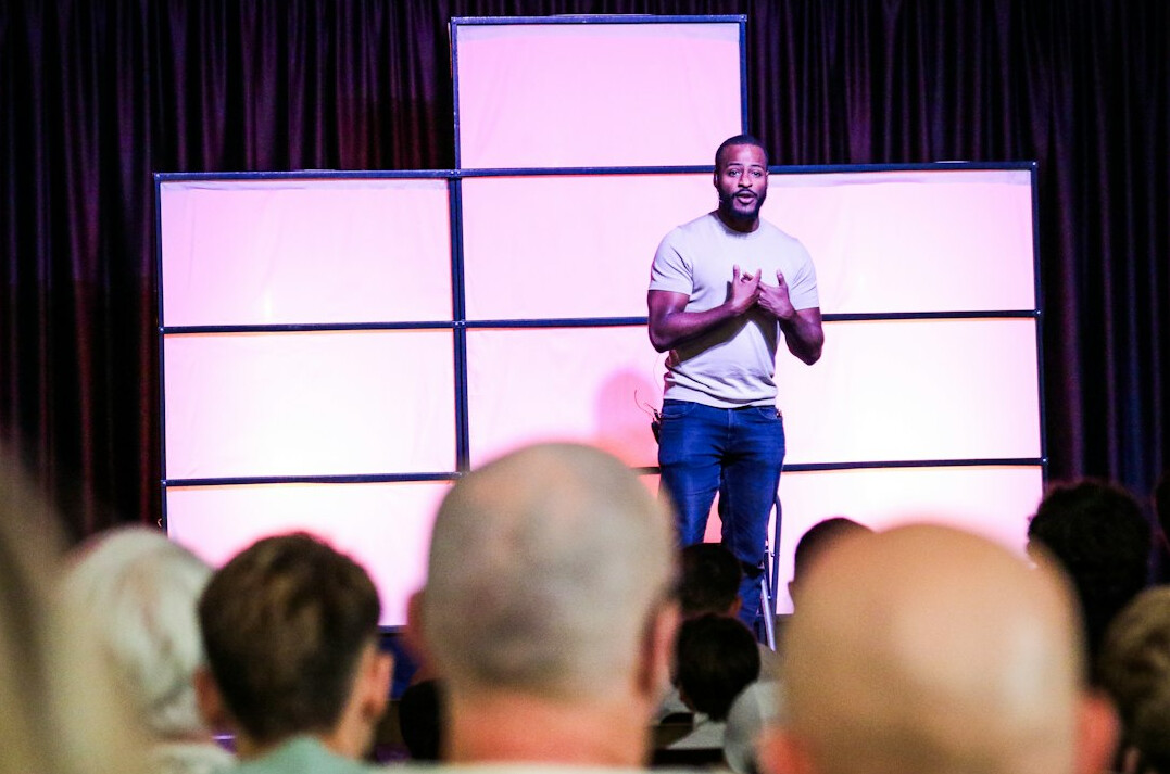 confident speaker on stage